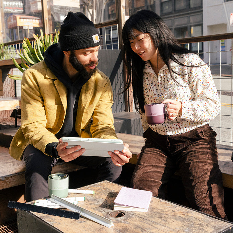 12oz-rise-mug-j2 12oz_rise_coffee_mug_dusty_orchid_couple_city_patio_square.jpg