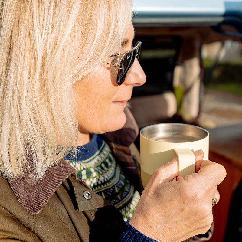 12oz-rise-mug-j2 12oz_rise_coffee_mug_wax_yellow_woman_drink_closeup_square.jpg