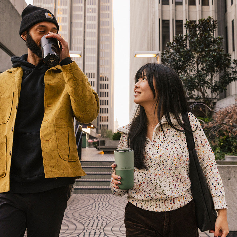 bring-your-own-party-kit-pints-and-tumblers-c6 16oz_rise_tumbler_black_iceberg_couple_drink_city_street_square.jpg