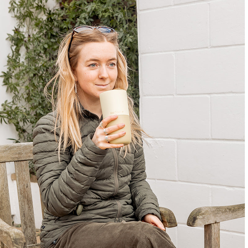 16oz-rise-tumbler-b2 16oz_rise_tumbler_wax_yellow_woman_seat_outside_square.jpg